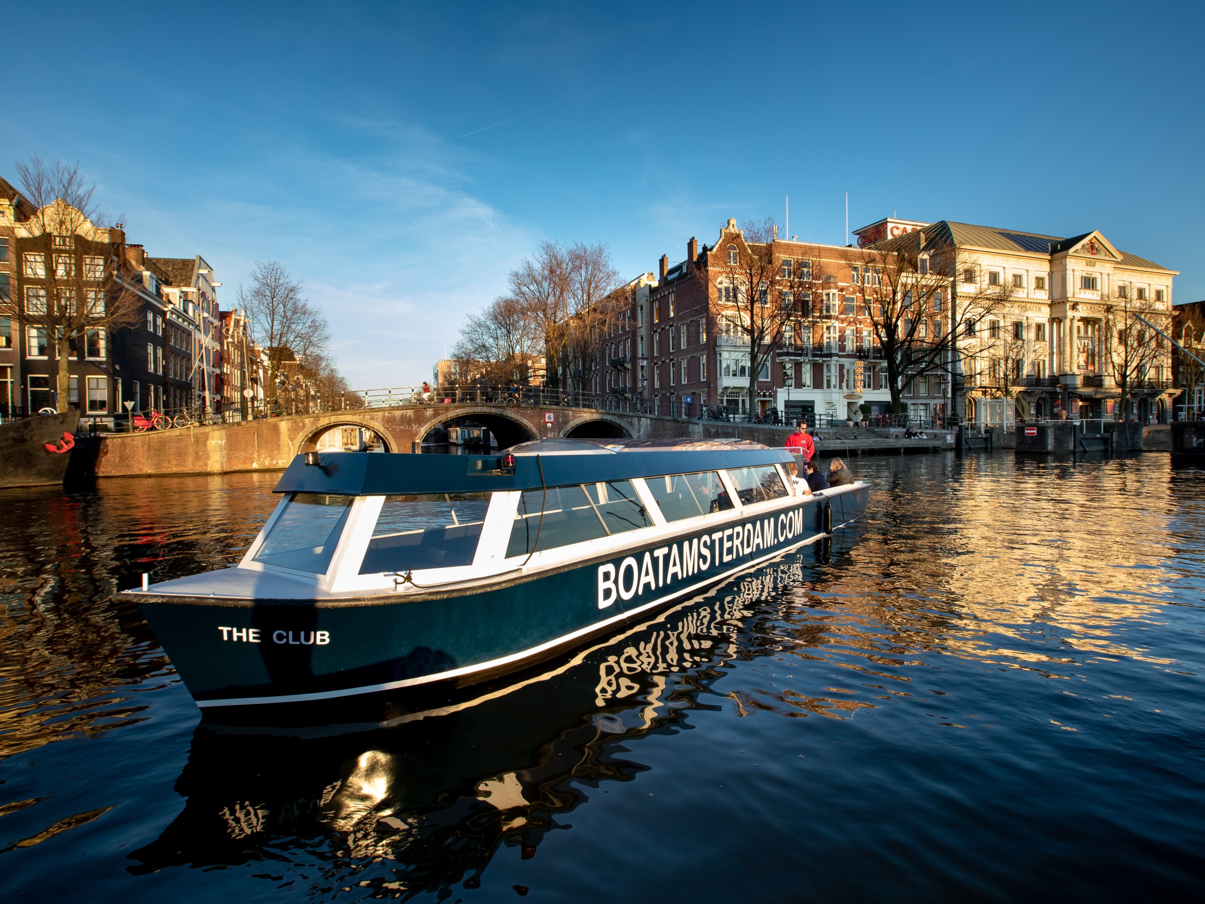 The Club boat sailing the canals
