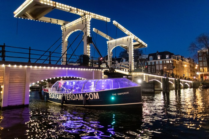 Our boats sailing the canals at Amsterdam Light Festival