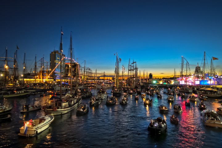 a harbor filled with lots of small boats in a body of water