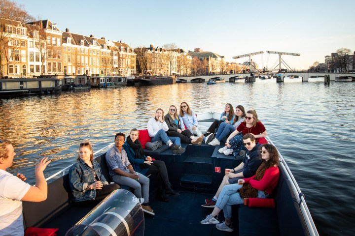 a group of people in a boat on a body of water