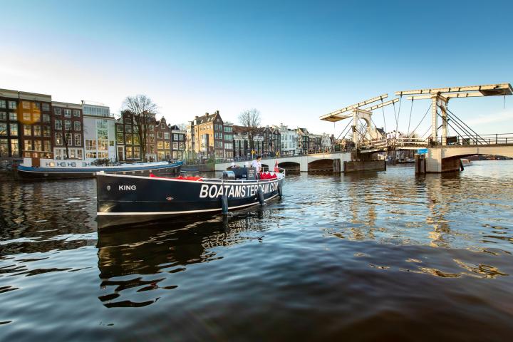 a small boat in a harbor next to a body of water