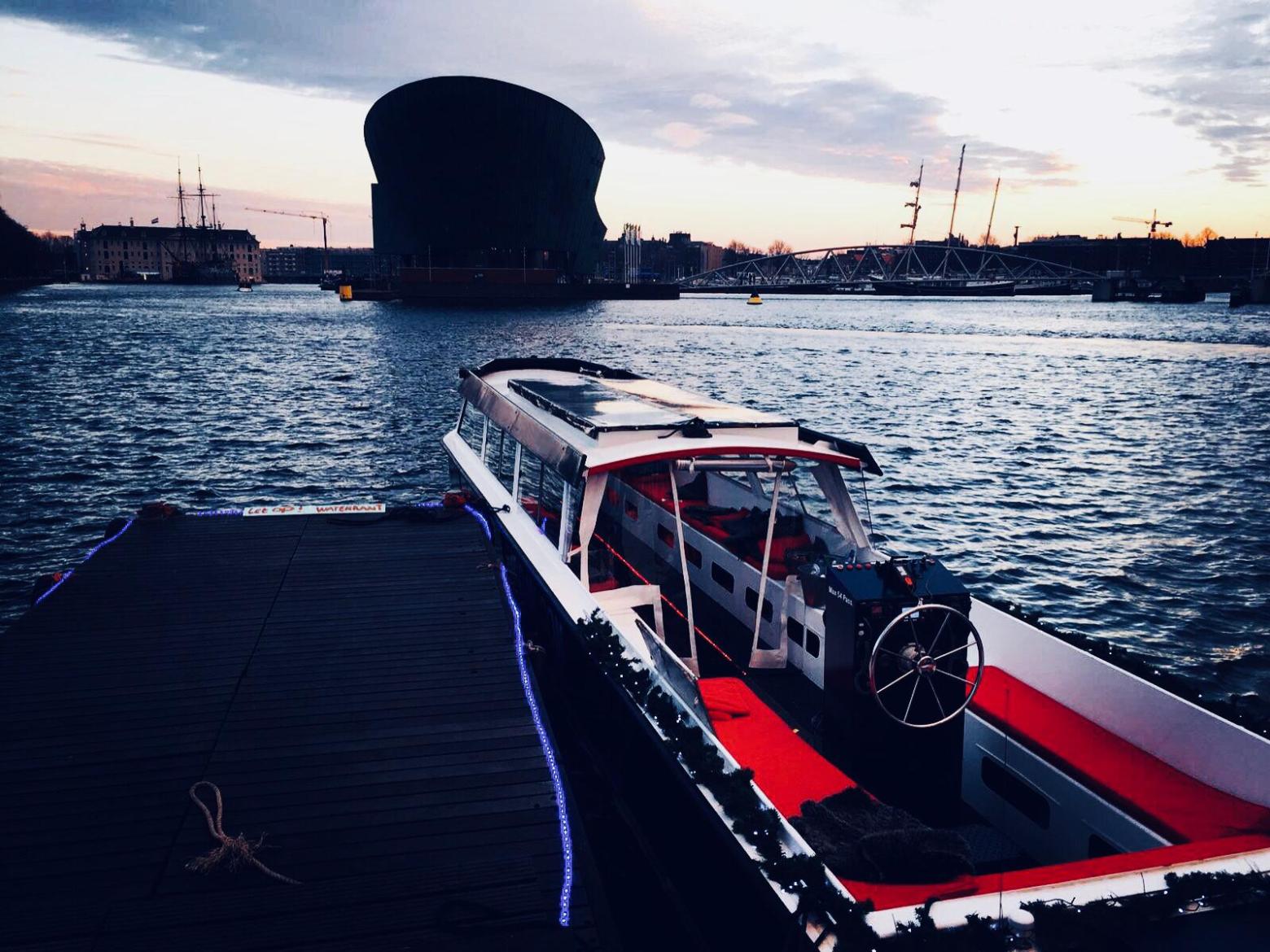 a boat traveling across a bridge over a body of water