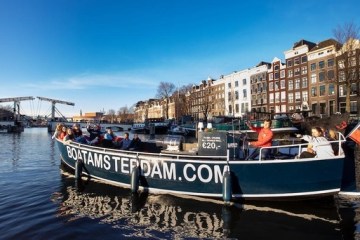 a boat is docked next to a body of water