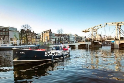 a boat is docked next to a body of water