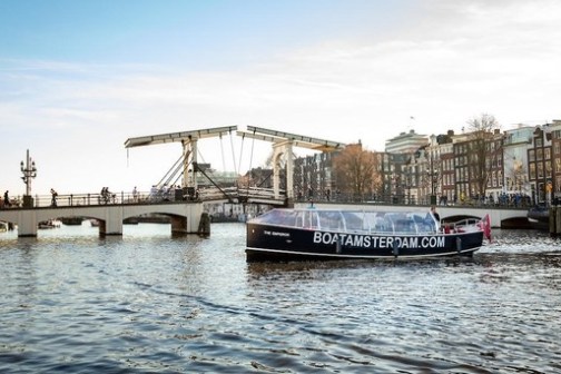 a boat is docked next to a body of water