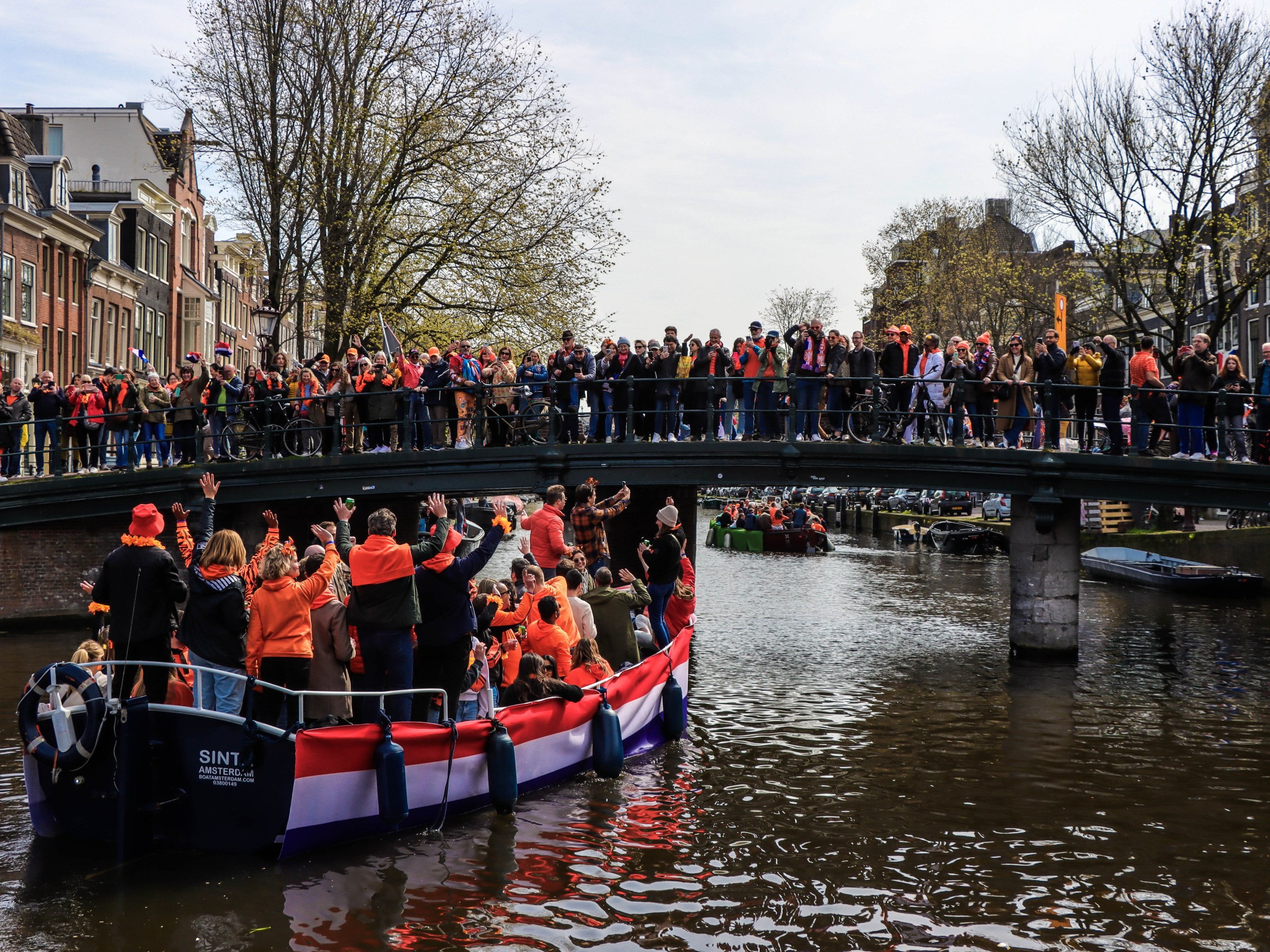 a group of people riding on the back of a boat