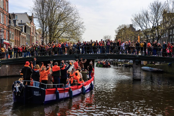 a group of people riding on the back of a boat